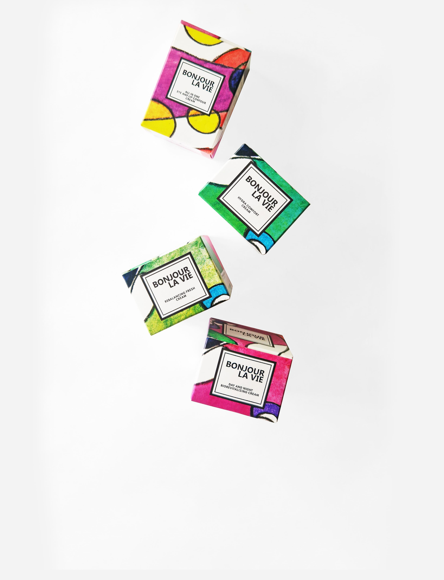 Immagine degli astucci colorati di All In One Eye and Lip Contour Cream, Hydra Comfort Cream, Rebalancing Fresh Cream e Day And Night BioRevitalizing Cream di Bonjour La Vie su fondo bianco