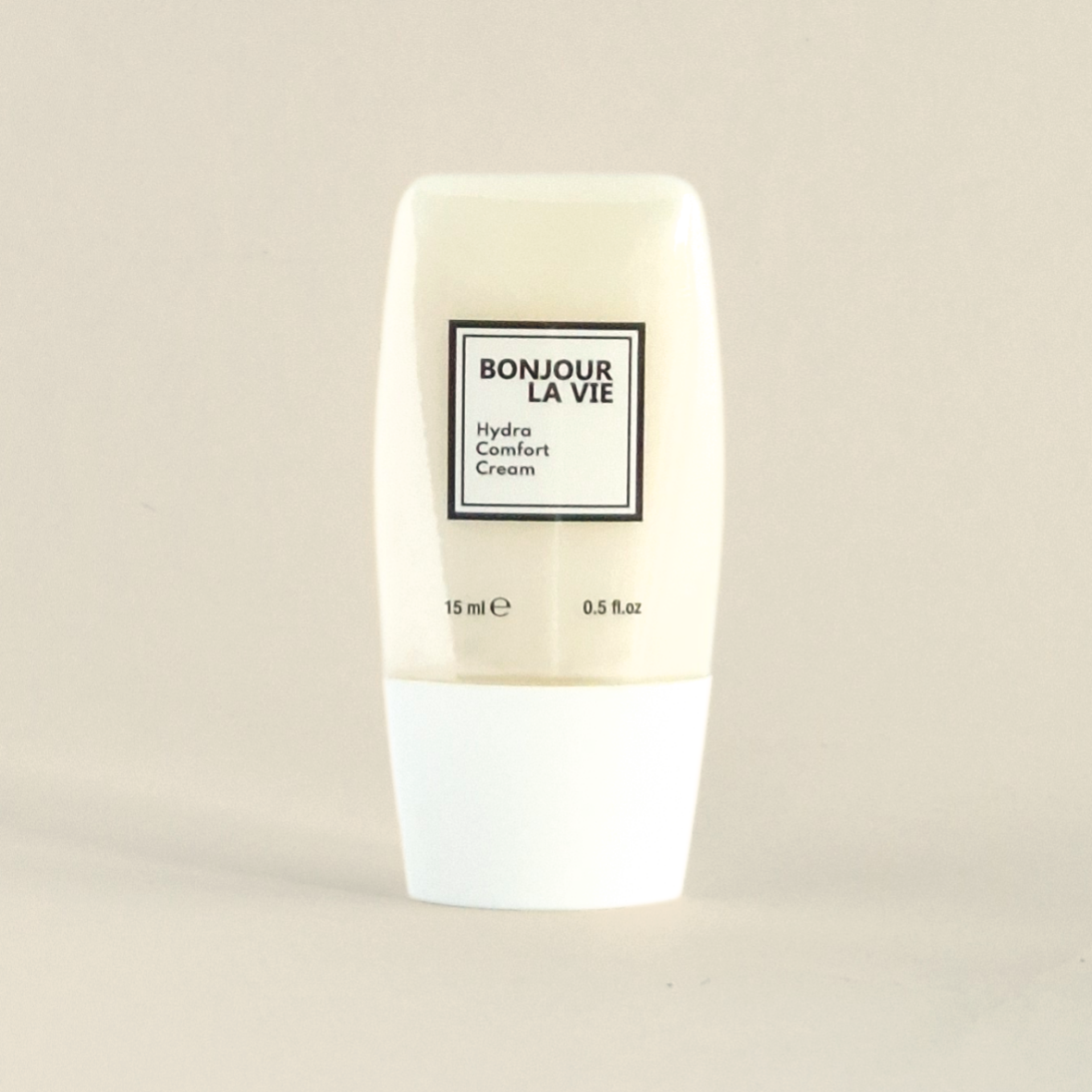 Flacone da 15 ml con tappo bianco e vaso trasparente di Hydra Comfort Cream di Bonjour La Vie.